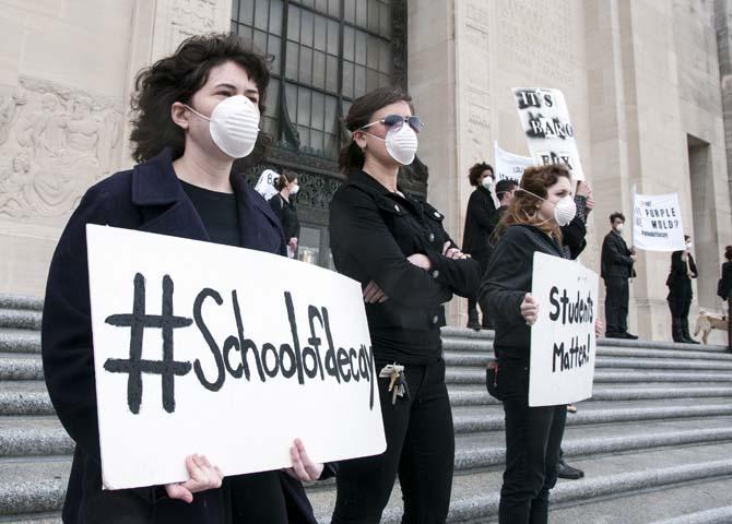 LSU School of Art &amp; Design students and supporters hold up signs in protest of the poor conditions in the Studio Arts Building on Tuesday, April 8, 2014, in front of the Louisiana State Capitol.