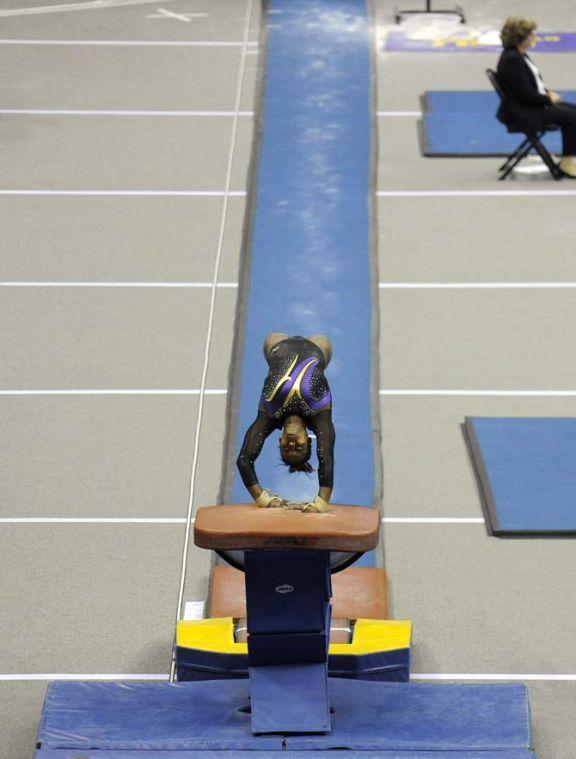 LSU junior all-around Britney Ranzy flips over the vault Saturday, April 5, 2014, during an NCAA Gymnastics Regional meet in the PMAC. The Tigers won the meet with a school-record score of 198.325.