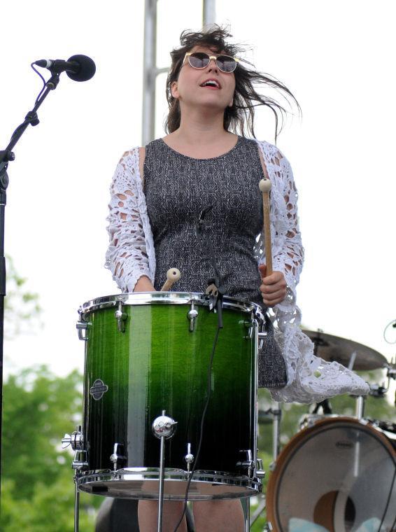 Vocalist Alexis Marceaux of Sweet Crude bangs on a drum Saturday, April 26, 2014 at the annual Festival International de Louisiane in Downtown Lafayette.