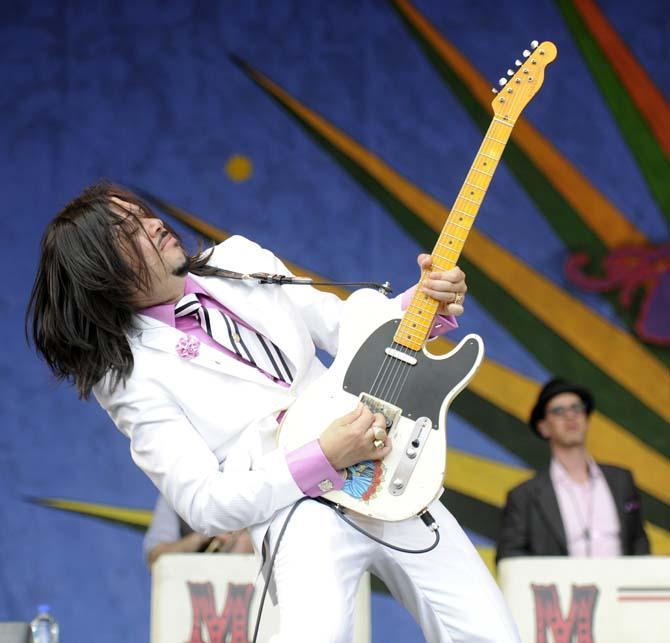 Eddie Perez of The Mavericks shreds on his guitar Saturday, April 26, 2014, during the New Orleans Jazz and Heritage Festival in New Orleans.