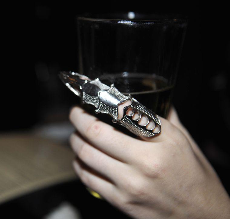 Megan O'Connor clutches her beer with her full finger ring Friday, March 28, 2014 during the Baton Rouge Area Steampunk Society social at the Londoner in Baton Rouge.