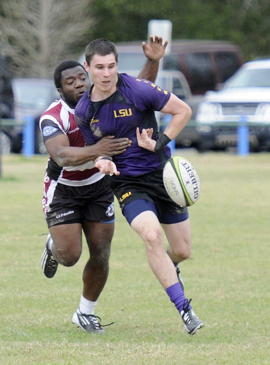 A Mississippi State defender strips the ball from LSU wing Aiden Elias during the Tigers' 75-5 win against the Bulldogs at Highland Road Community Park.