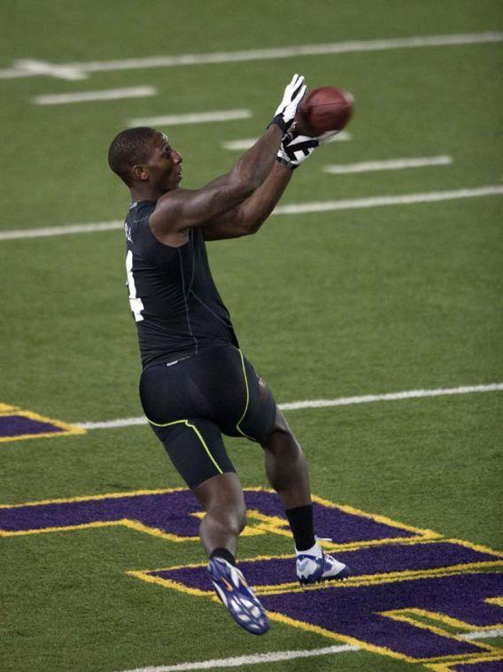 LSU senior running back Alfred Blue (4) catches a pass on Wednesday, April 9, 2014 during LSU Pro Day in the LSU Indoor Practice Facility.