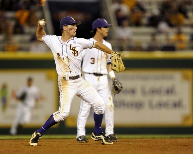 LSU sophomore infielder Alex Bregman (8) throws to first for an out Friday, April 25, 2014 during the Tigers' 8-7 victory against Tennessee at Alex Box Stadium.