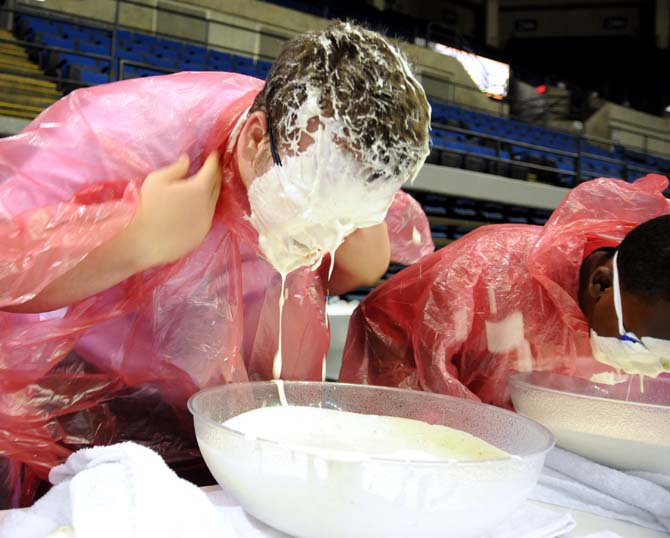 A contestant's face drips with ranch dressing during a bobbing for wings competition Saturday, April 26, 2014 during the first annual Louisiana Wing-a-thon at the Baton Rouge River Center.