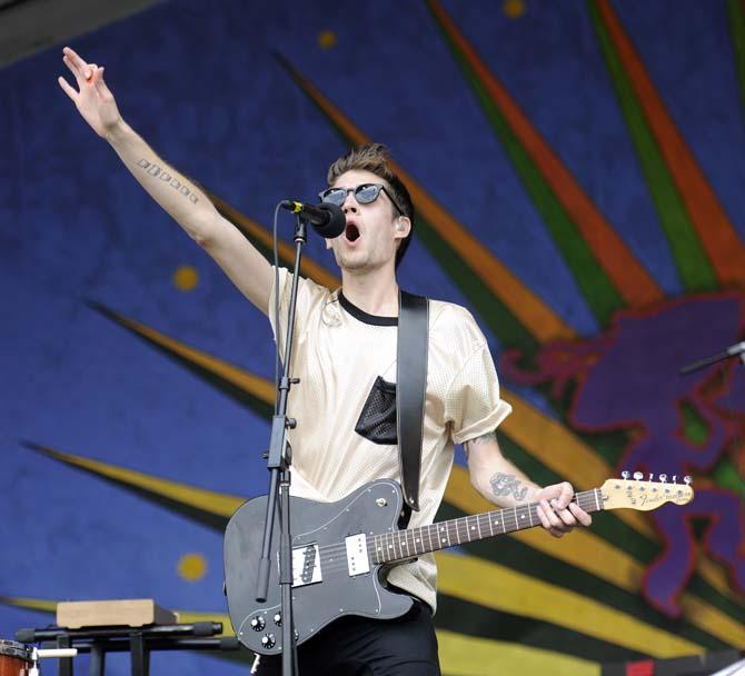 Royal Teeth singer and guitarist Gary Larsen belts to the crowd Sunday, April 27, 2014, during the New Orleans Jazz and Heritage Festival.