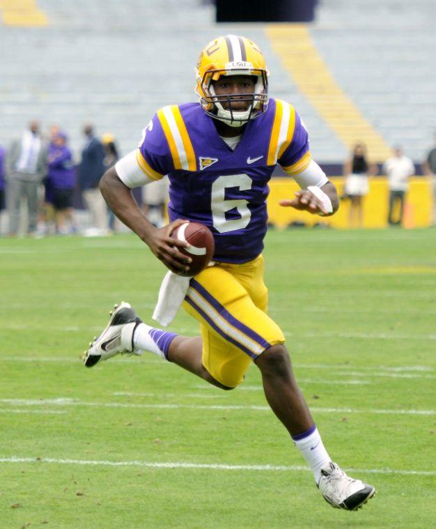 LSU freshman quarterback Brandon Harris (6) runs downfield Saturday, April 5, 2014 during the white squad's 42-14 victory against the purple squad in the National L Club Spring Game in Tiger Stadium.