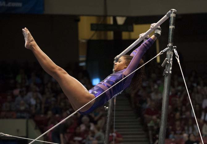 LSU sophomore all-around gymnast Randii Wyrick swings on the bars Saturday, April 19, 2014 during the first rotation of the NCAA Super Six Finals in Birmingham, Ala.