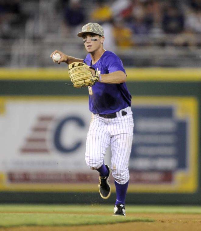 LSU sophomore infielder Alex Bregman (8) looks to throw to first Tuesday, April 22, 2014, during the Tigers' 6-0 win against Tulane in Alex Box Stadium.