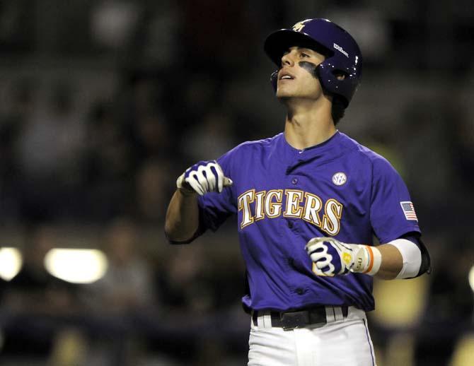 LSU freshman infielder Kramer Robertson (3) walks back to the plate Friday, March 7, 2014 during the Tigers' 10-0 victory against Purdue at Alex Box Stadium.