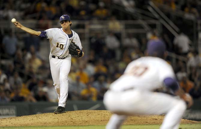 LSU junior pitcher Aaron Nola (10) attempts a pick off Friday, April 25, 2014 during the Tigers' 8-7 victory against Tennessee at Alex Box Stadium.