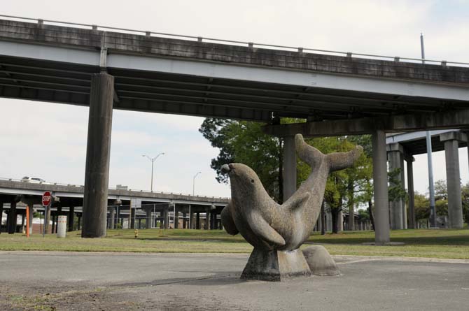 A concrete sculpture of an aquatic creature sits in the shadow of I-10 on Wednesday, April 2, 2014, in Old South Baton Rouge.