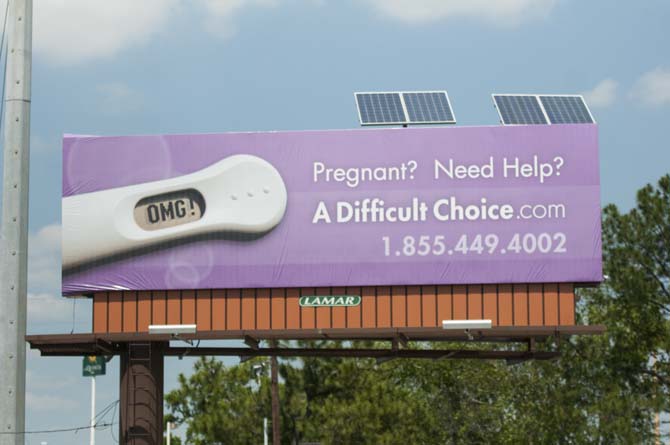 A Difficult Choice ad is displayed Wednesday, April 23, 2014 near Perkins Rd and South Acadian.