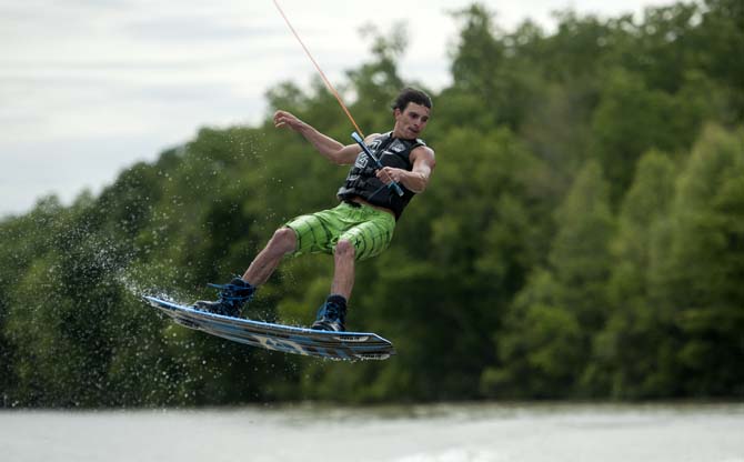 LSU wakeboarder Jordan Hughes prepares to land a wakeboarding trick Wednesday, April 30, 2014, in the Gulf Intracoastal Waterway.