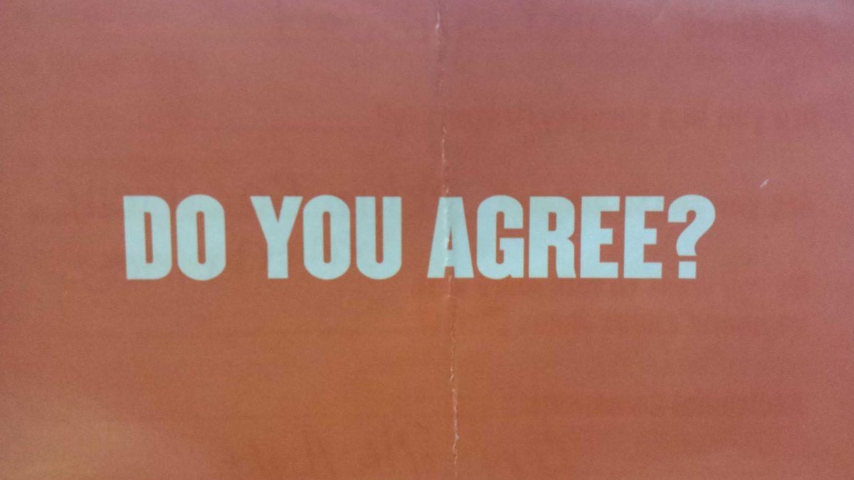 Signs posted around campus raise the question, "do you agree with Adam?"