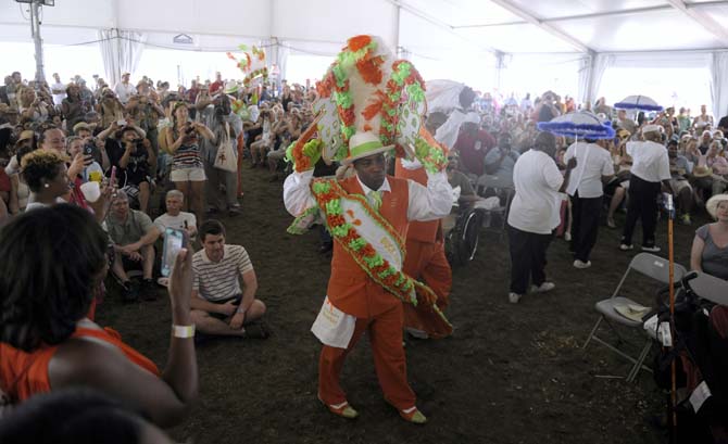 A member of MBJ dances during the Treme Brass Band's performance on Saturday, April 26, 2014, during the New Orleans Jazz and Heratige Festival.