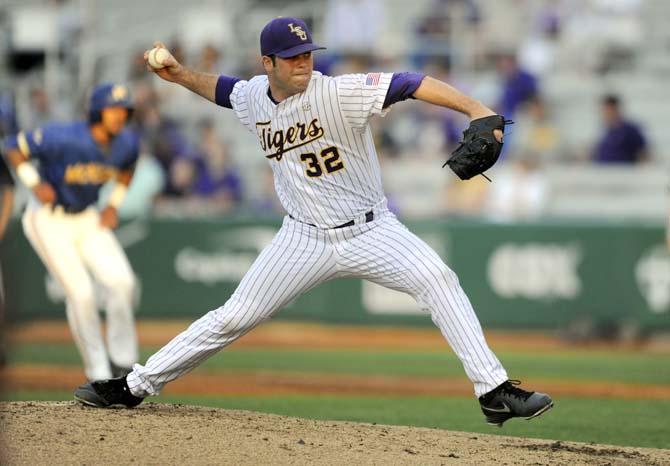 LSU freshman right-handed pitcher Alden Cartwright (32) winds up before a pitch Wednesday, April 2, 2014, during the Tigers' 10-3 victory against McNeese in Alex Box Stadium.