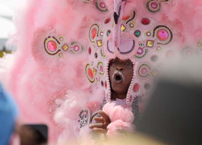 A Mardi Gras Indian sings to festival-goers Saturday, April 26, 2014, during the New Orleans Jazz and Heratige Festival.