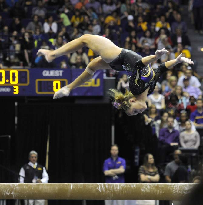 LSU senior all-around Kaleigh Dickson flips on the balance beam Saturday, April 5, 2014, during an NCAA Gymnastics Regional meet in the PMAC. The Tigers won the meet with a school-record score of 198.325.