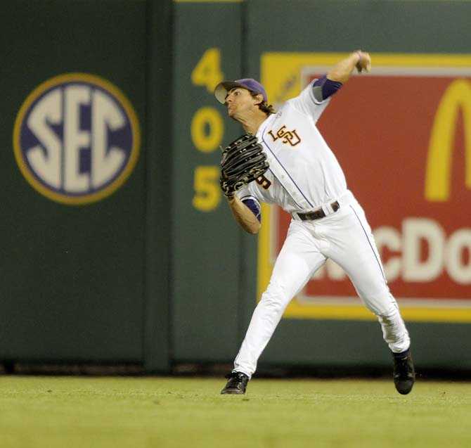 LSU sophomore outfielder Mark Laird (9) throws to the infield Friday, April 25, 2014 during the Tigers' 8-7 victory against Tennessee at Alex Box Stadium.