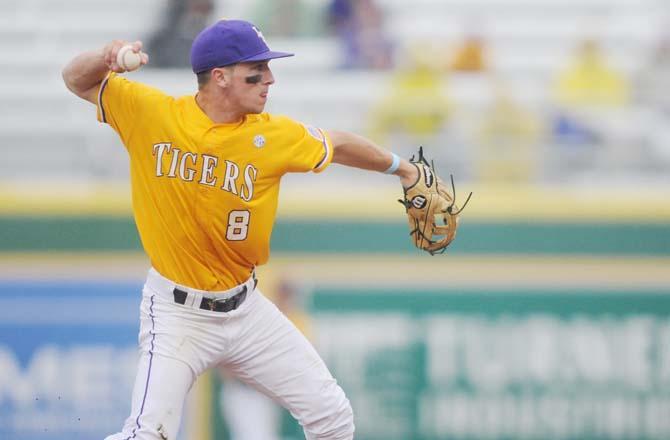 LSU sophomore infielder Alex Bregman (8) throws for an out at first Sunday, April 6, 2014 during the Tigers' 17-4 victory against Mississppi State at Alex Box Stadium.