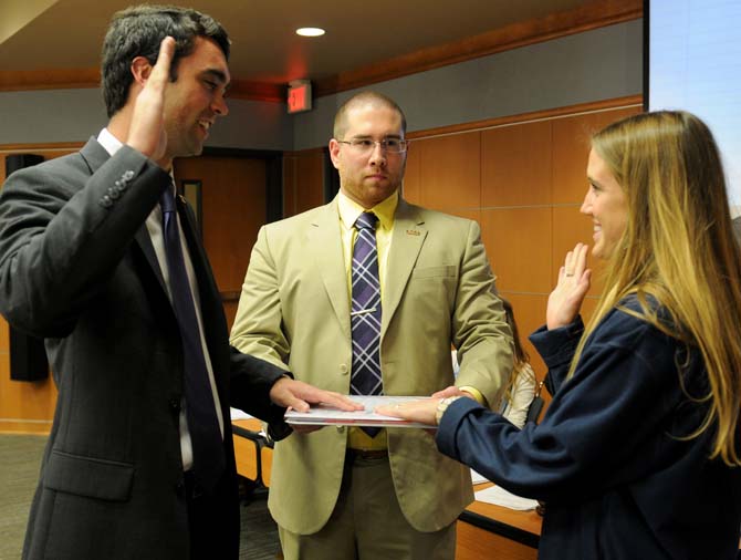 Recently elected Student Government President Clay Tufts and Vice President Taylor Lambert are inaugurated into office by Deputy Chief Justice Dario Scalco Wednesday, April 9, 2014.