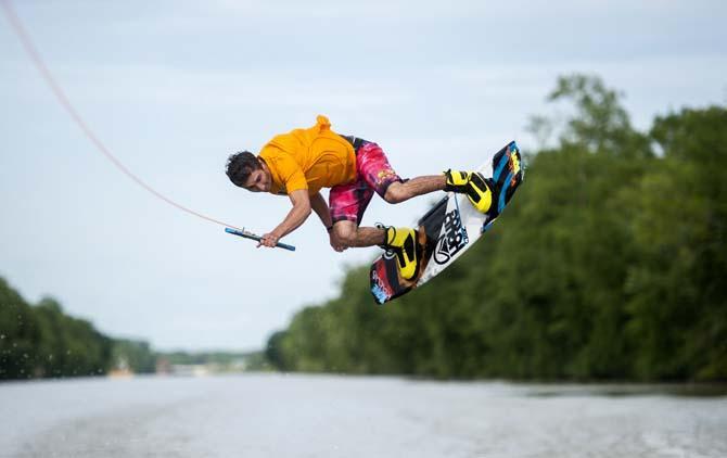 LSU wakeboarder Kyle Jordan flips on his wakeboard while doing a trick Wednesday, April 30, 2014, in the Gulf Intracoastal Waterway.