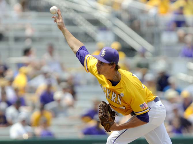 LSU senior right-handed pitcher Kurt McCune (39) pitches the ball to home plate Sunday, April 27, 2014, during the Tigers' 9-4 victory against Tennessee in Alex Box Stadium.