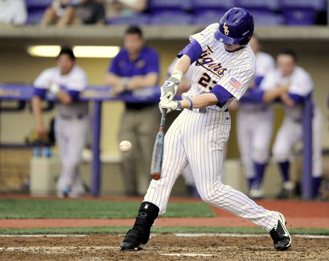 LSU senior outfielder Sean McMullen (23) swings at the ball Wednesday, April 2, 2014, during the Tigers' 10-3 victory against McNeese in Alex Box Stadium.