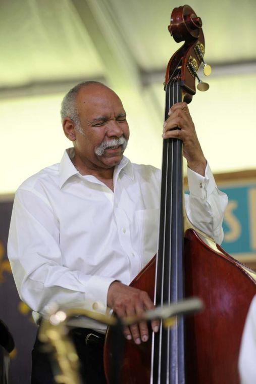 Richard Moten of the Original Tuxedo Jazz Band plays the standing bass Sunday, April 27, 2014, during the New Orleans Jazz and Heritage Festival.