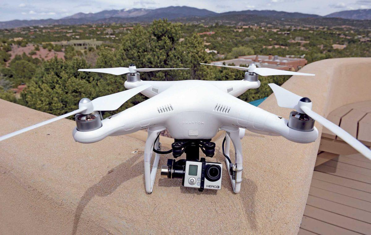 The remote controlled DJI Phantom drone with an attached GoPro 3 camera used by Brian Tercero of Keller Williams Realty used to create a high definition video of a property is seen in Santa Fe, N.M. on April 18, 2014. (AP Photo/The Santa Fe New Mexican, Clyde Mueller)