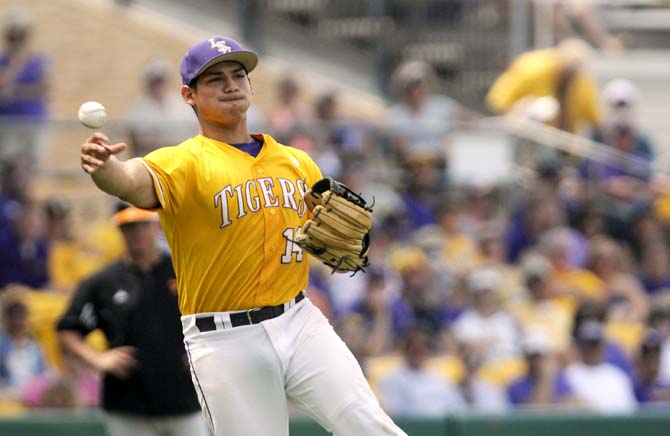 LSU senior infielder Christian Ibarra (19) throws the ball to first base Sunday, April 27, 2014, during the Tigers' 9-4 victory against Tennessee in Alex Box Stadium.