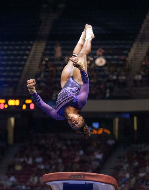 LSU junior all-around gymnast Lloimincia Hall flips off the vault Saturday, April 19, 2014 during the fifth rotation of the NCAA Super Six Finals in Birmingham, Ala.