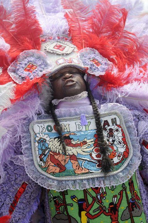 A Mardi Gras Indian sings to festival-goers Saturday, April 26, 2014, during the New Orleans Jazz and Heratige Festival.