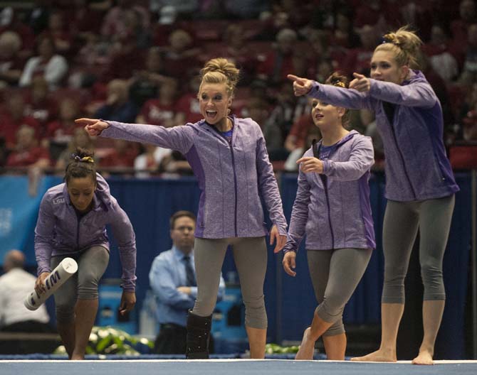 LSU senior all-around gymnast Kaleigh Dickson chants with the crowd and her teammates Saturday, April 19, 2014 during the fourth rotation of the NCAA Super Six Finals in Birmingham, Ala.