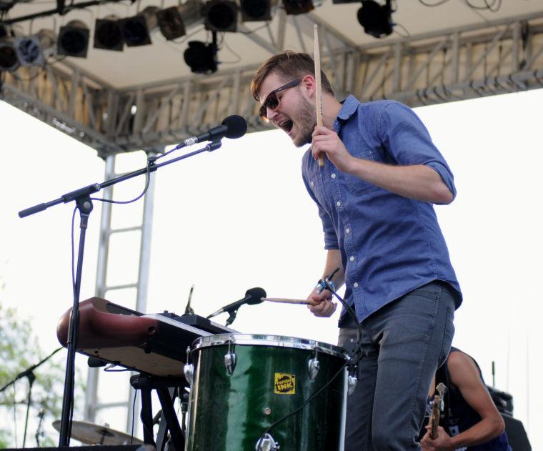 A band member of Sweet Crude sings to the crowd Saturday, April 26, 2014 at the annual Festival International de Louisiane in Downtown Lafayette.