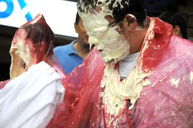 A contestant's face drips with ranch dressing during a bobbing for wings competition Saturday, April 26, 2014 during the first annual Louisiana Wing-a-thon at the Baton Rouge River Center.