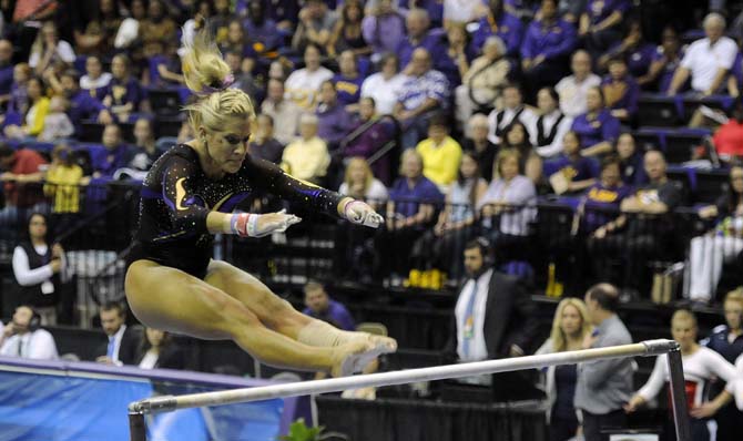 LSU senior all-around Sarie Morrison flips on uneven bars Saturday, April 5, 2014, during an NCAA Gymnastics Regional meet in the PMAC. The Tigers won the meet with a school-record 198.325.