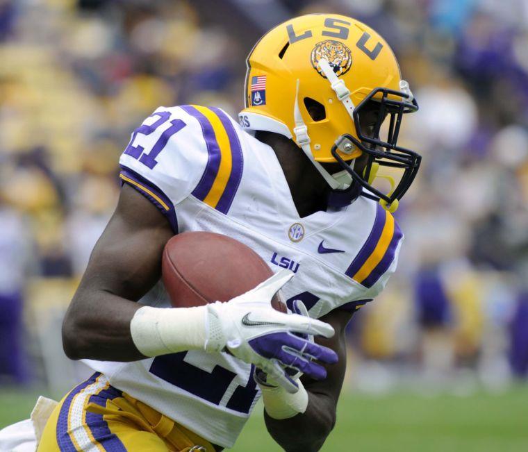 LSU sophomore defensive back Rashard Robinson (21) runs with the ball Saturday, April 5, 2014 during the white squad's 42-14 victory against the purple squad in the National L Club Spring Game in Tiger Stadium.