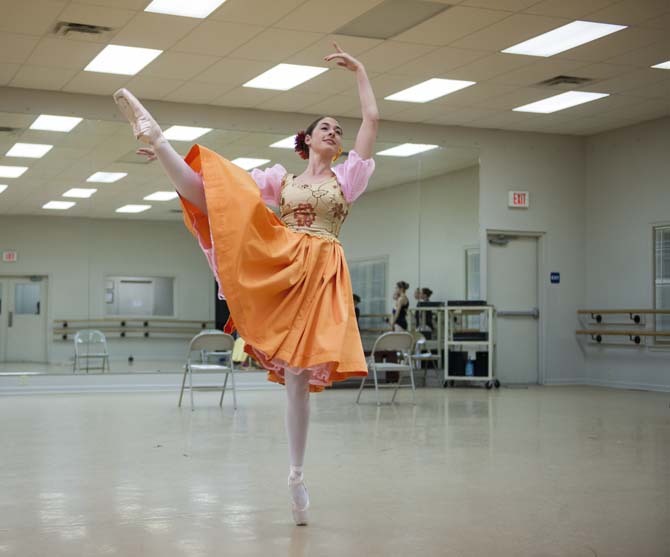 Biology student Caroline Schulenberg practices a routine Tuesday, April 1, 2014, from the upcoming production of "Snow White" in the BRBT studio on Bluebonnet Blvd.