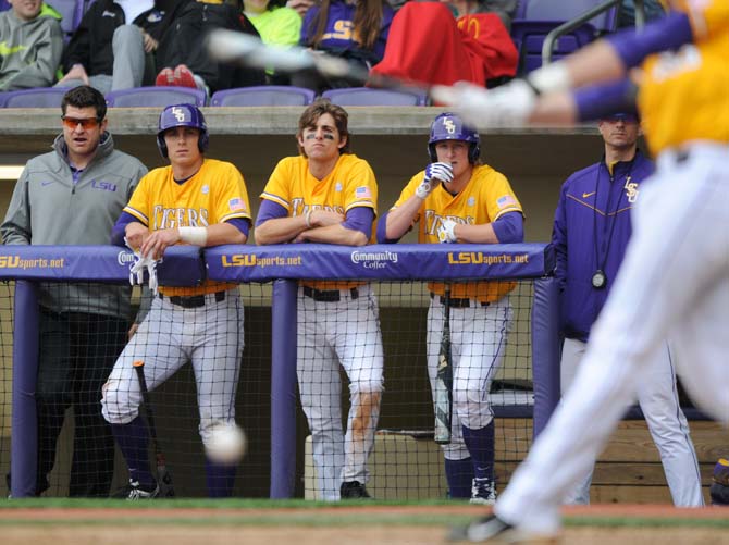 The LSU baseball team watches junior infielder Conner Hale (20) bat at the plate Sunday, March 23, 2014 during the Tigers' 2-2 tie against Georgia at Alex Box Stadium.