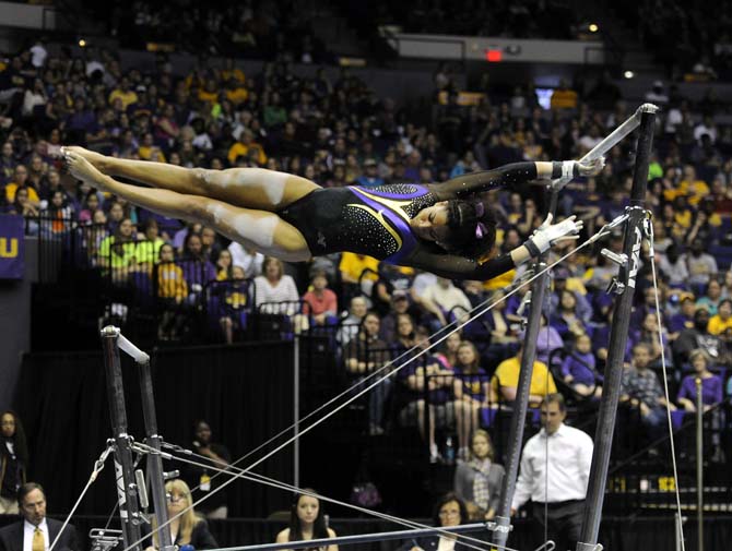 LSU sophomore all-around Randii Wyrick flips on uneven bars Saturday, April 5, 2014, during an NCAA Gymnastics Regional meet in the PMAC. The Tigers won the meet with a school-record score of 198.325.