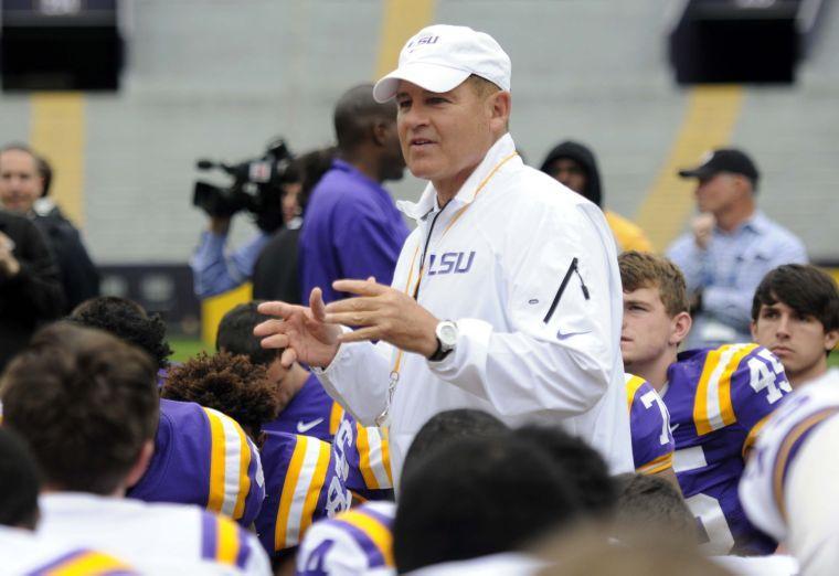 Les Miles speaks to the team Saturday, April 5, 2014 after the white squad's 42-14 victory against the purple squad in the National L Club Spring Game in Tiger Stadium.