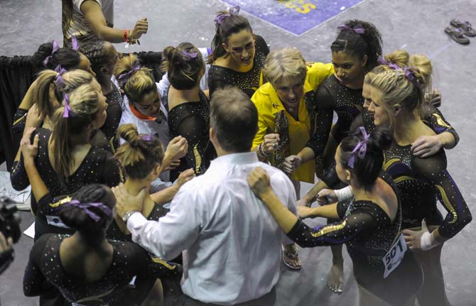 LSU gymnastics head coach D-D Breaux pumps up her team Saturday, April 5, 2014, during an NCAA Gymnastics Regional meet in the PMAC.