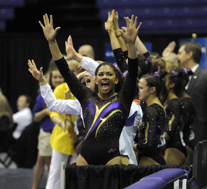 LSU sophomore all-around Randii Wyrick and her team chant for a 10 Saturday, April 5, 2014, during an NCAA Gymnastics Regional meet in the PMAC. The Tigers won the meet with a school-record score of 198.325.