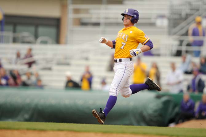 LSU senior outfielder Sean McMullen (7) runs to second base Sunday, April 6, 2014 during the Tigers' 17-4 victory against Mississippi State at Alex Box Stadium.