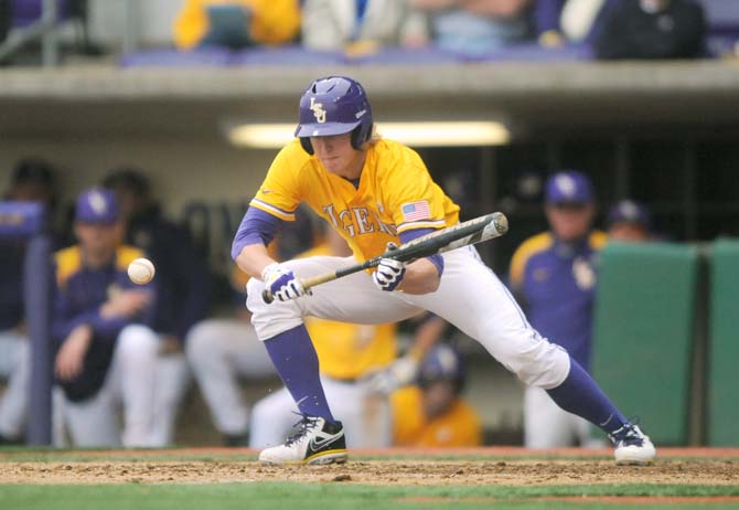 LSU sophomore outfielder Andrew Stevenson (6) bunts Sunday, April 6, 2014 during the Tigers' 17-4 victory against Mississippi State at Alex Box Stadium.