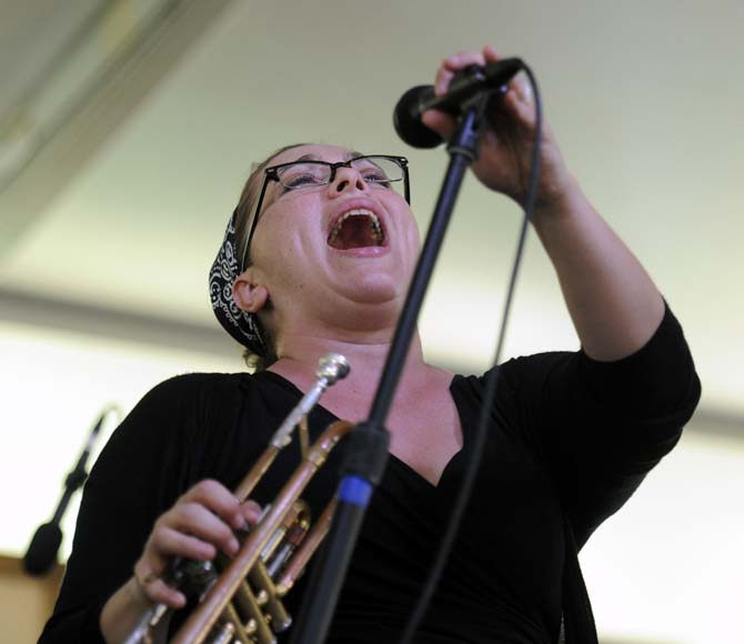 Marla DIxon of the Shotgun Jazz Band sings Saturday, April 26, 2014, during the New Orleans Jazz and Heratige Festival.