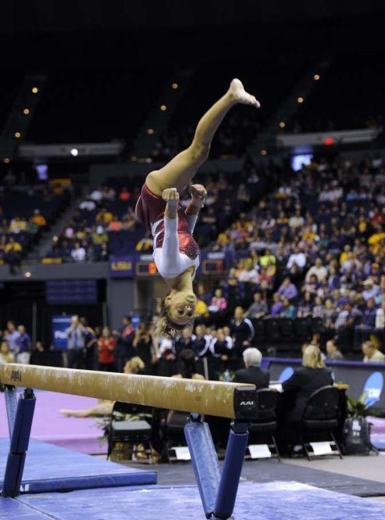 A Stanford gymnast performs her beam routine Saturday, April 5, 2014, during the NCAA Gymnastics Regional in the PMAC. The Cardinals placed second in the meet.