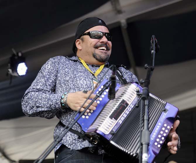 Terrance Semien plays the accordion Saturday, April 26, 2014, during the New Orleans Jazz and Heritage Festival.